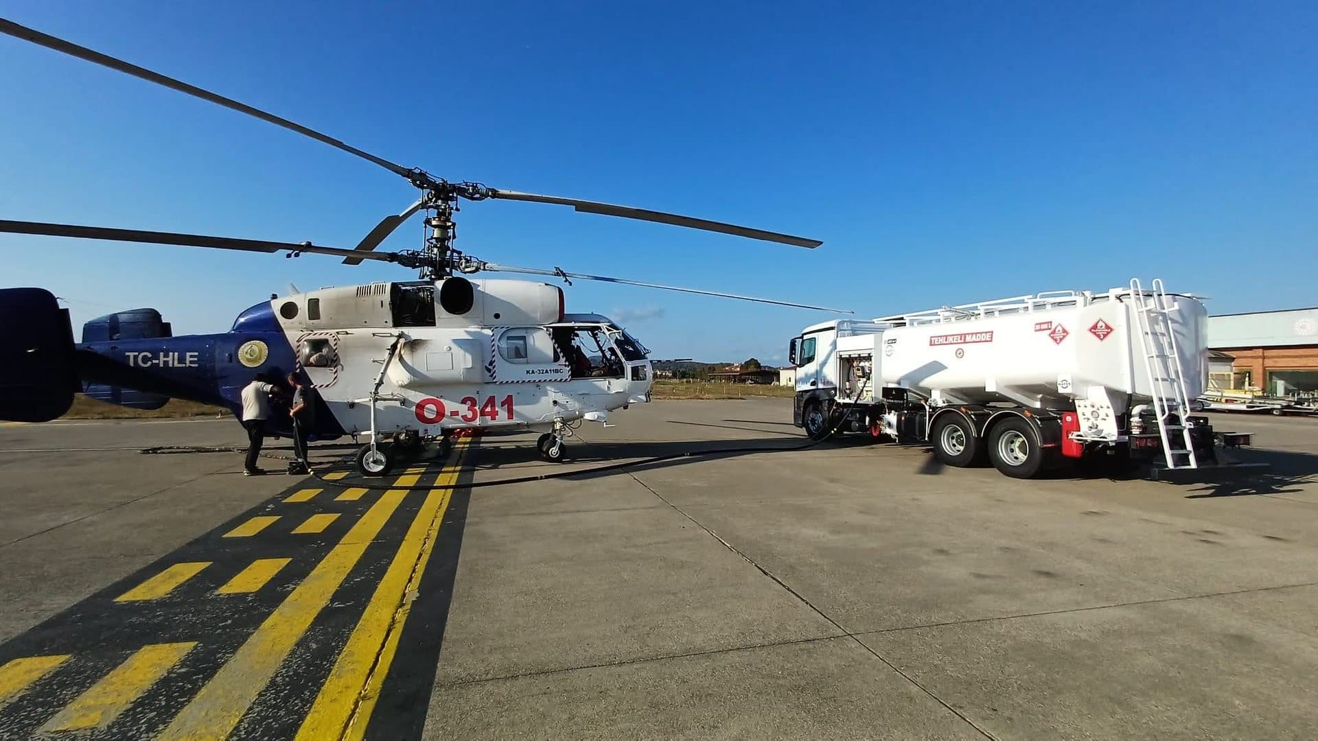 MATEŞ rigid refueller fuelling a Ka-32 helicopter on the apron